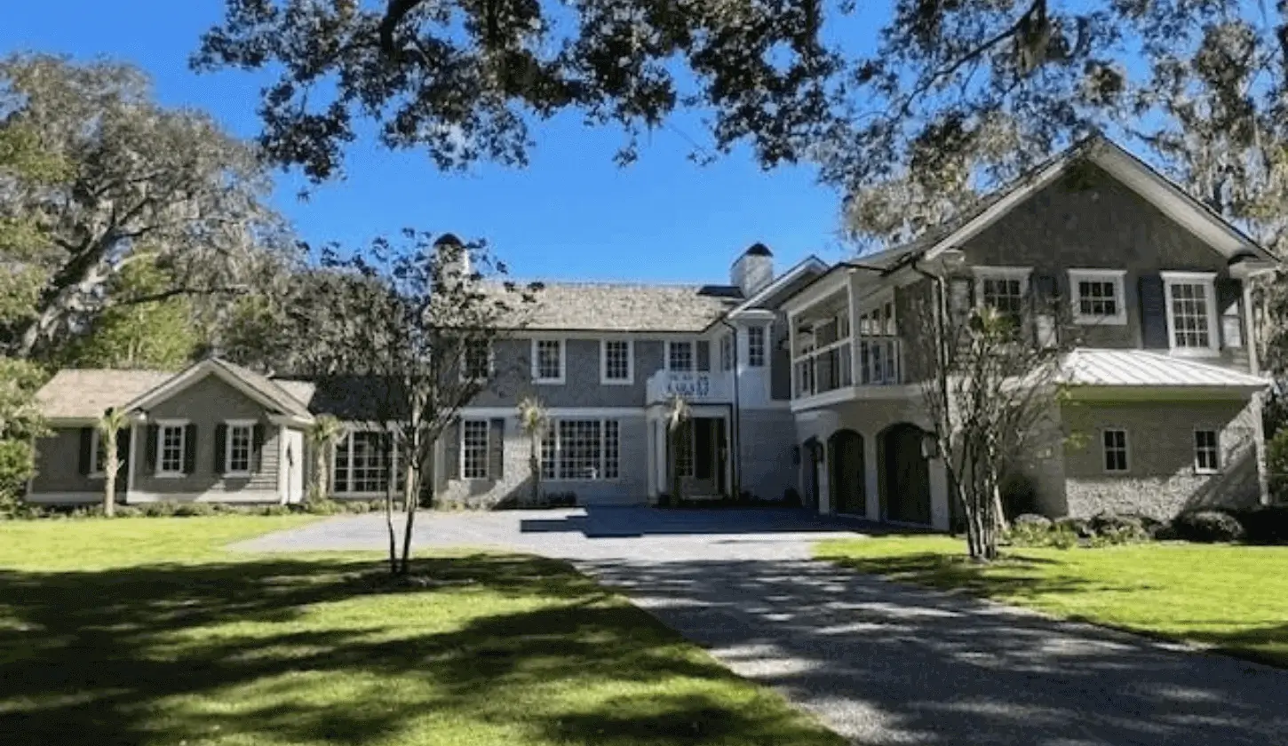 Driveway leading to spacious estate with porch